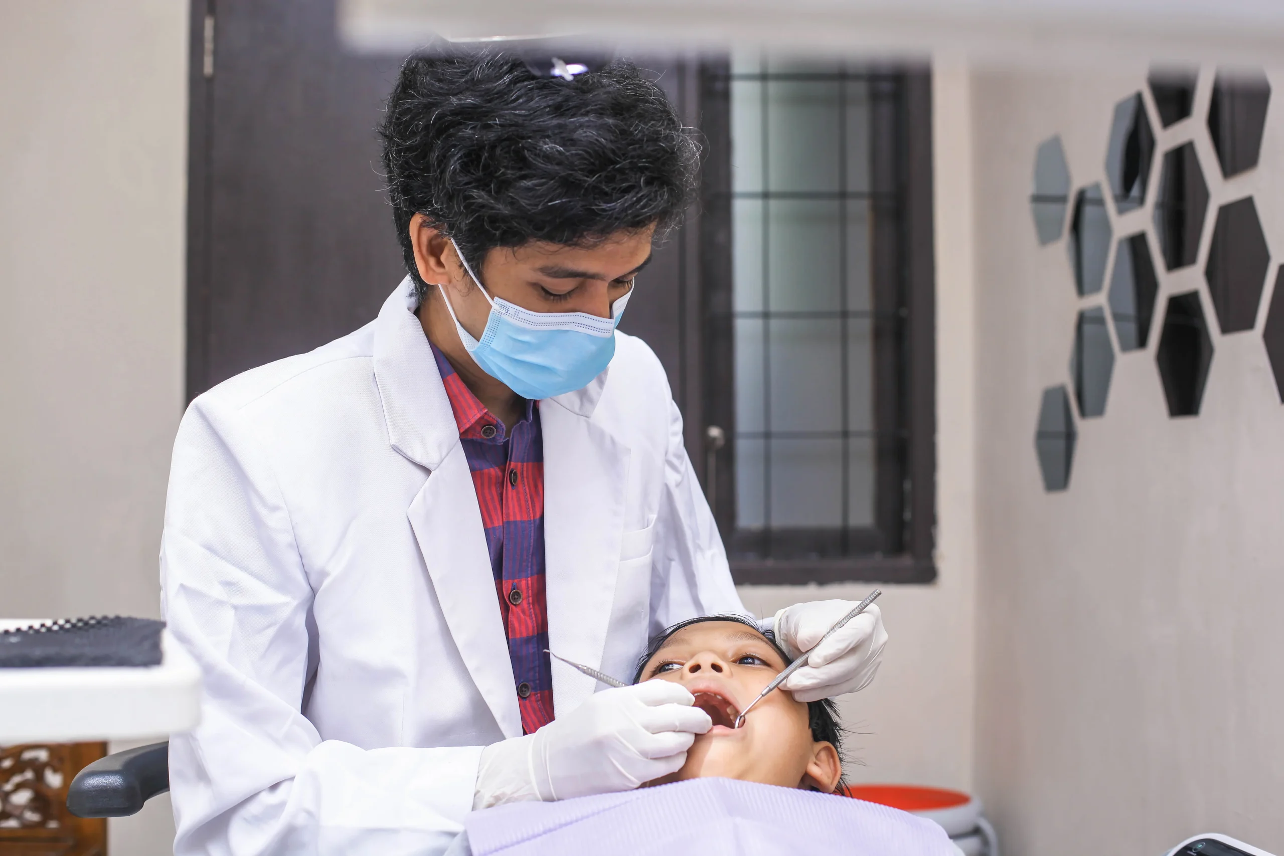 dentist examining boy patient teeth 2025 01 27 11 01 17 utc