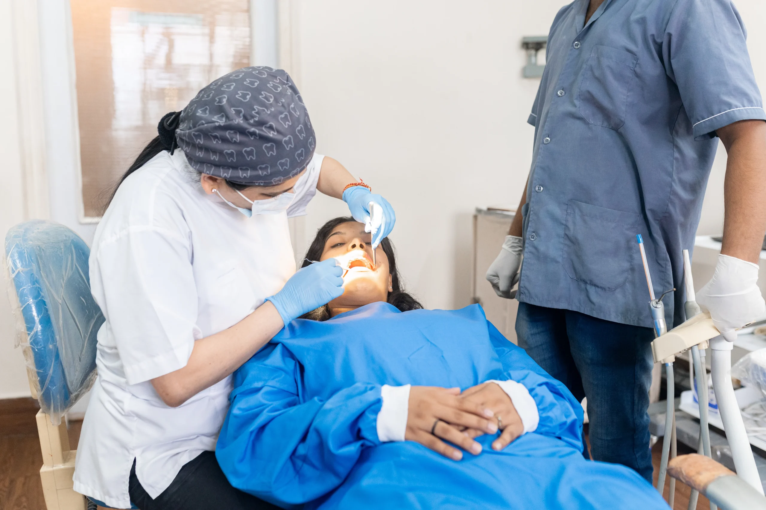 indian woman dentist examining the mouth of a pati 2025 01 10 04 29 54 utc